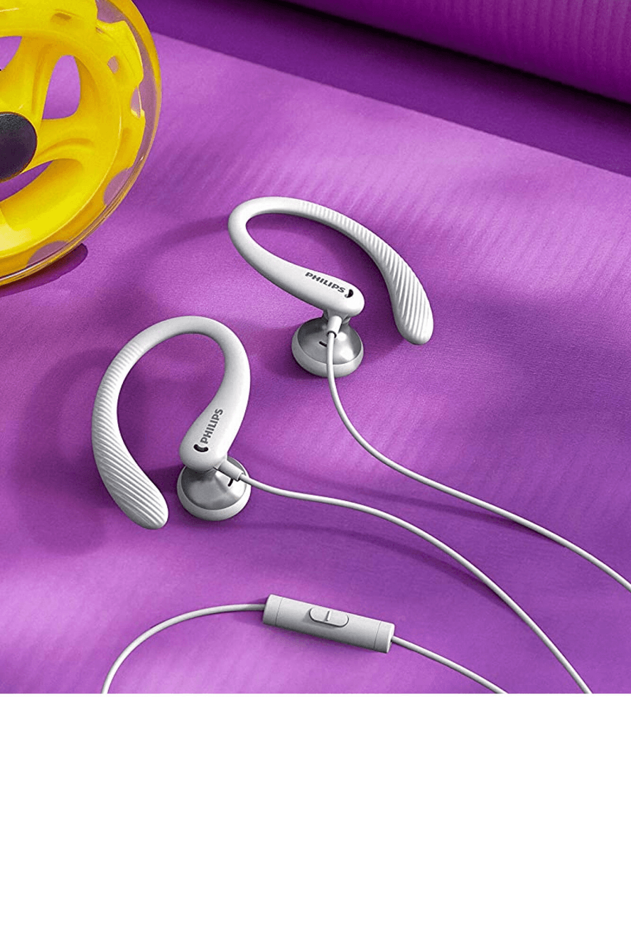 Auriculares deportivos Philips TAA1105/00 blancos sobre fondo violeta